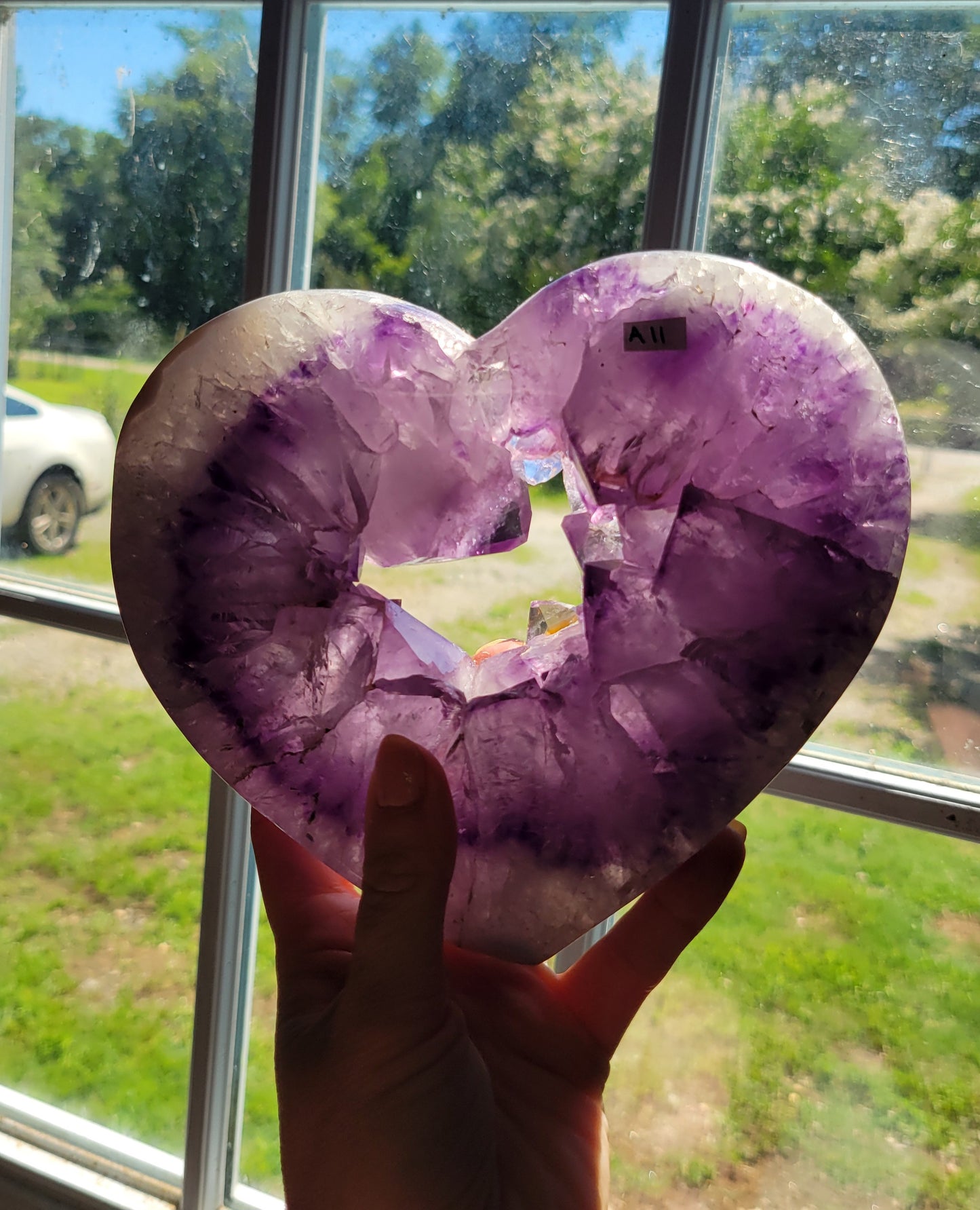 Purple amethyst heart on stand from Brazil